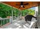 Inviting porch with a wood ceiling and comfortable seating for relaxation at 1290 Magnolia Park Cir, Cumming, GA 30040