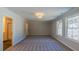 Bedroom with two large windows, light gray walls, and soft carpeting at 154 Bluffington Way, Marietta, GA 30066