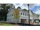 New two story townhome featuring siding and brick with an attached drive-under garage at 154 Bluffington Way, Marietta, GA 30066
