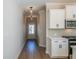 Hallway with a modern light fixture and doorway leading to the front door at 154 Bluffington Way, Marietta, GA 30066