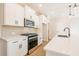 Modern kitchen featuring stainless steel appliances, tile backsplash and hardwood floors at 154 Bluffington Way, Marietta, GA 30066