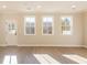Bright living area with hardwood floors and large windows providing lots of sunlight at 154 Bluffington Way, Marietta, GA 30066