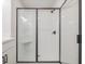 Modern bathroom with black framed glass shower and built-in shower bench at 154 Bluffington Way, Marietta, GA 30066