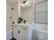 The bathroom features a modern vanity with drawers, a mirror, and tub with shower at 1956 Deco Dr, Kennesaw, GA 30144