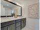 The bathroom features a double sink vanity with framed mirror and decorative wall art at 1956 Deco Dr, Kennesaw, GA 30144