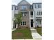 Stylish townhouse with a well-maintained lawn and attractive architectural details in a friendly neighborhood at 1956 Deco Dr, Kennesaw, GA 30144