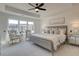 The main bedroom includes seating near a bright window, carpet, and modern decor at 1956 Deco Dr, Kennesaw, GA 30144