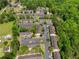 Overhead view of a well-maintained townhome community nestled among mature trees and convenient parking at 6554 Arbor Gate Sw Dr # 4, Mableton, GA 30126
