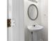 Bathroom with pedestal sink, oval mirror, and white wall at 6554 Arbor Gate Sw Dr # 4, Mableton, GA 30126