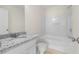 Clean bathroom featuring granite countertop, white cabinets and tub/shower combo at 6554 Arbor Gate Sw Dr # 4, Mableton, GA 30126