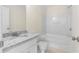 Bathroom with granite countertop vanity, toilet, and shower-tub combination at 6554 Arbor Gate Sw Dr # 4, Mableton, GA 30126