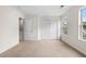 Bedroom with plush carpet, closet, and bright windows offering natural light at 6554 Arbor Gate Sw Dr # 4, Mableton, GA 30126