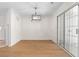 Dining room with modern light fixture and sliding glass doors to the outdoor area at 6554 Arbor Gate Sw Dr # 4, Mableton, GA 30126