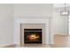 Close up on a gas fireplace with white mantel and light colored marble hearth at 6554 Arbor Gate Sw Dr # 4, Mableton, GA 30126