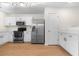 Spacious kitchen featuring stainless steel appliances, ample counter space and white cabinets at 6554 Arbor Gate Sw Dr # 4, Mableton, GA 30126