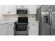 Modern kitchen with stainless steel appliances and white countertops at 6554 Arbor Gate Sw Dr # 4, Mableton, GA 30126