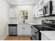 Bright kitchen with stainless steel appliances, white cabinets, and a window view at 6554 Arbor Gate Sw Dr # 4, Mableton, GA 30126