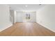 Bright living room boasts hardwood floors, freshly painted walls, and a staircase at 6554 Arbor Gate Sw Dr # 4, Mableton, GA 30126