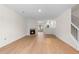 Bright living room boasts a fireplace, hardwood floors, and an open concept design at 6554 Arbor Gate Sw Dr # 4, Mableton, GA 30126