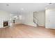 Bright living room boasts a fireplace, hardwood floors, and an open concept design at 6554 Arbor Gate Sw Dr # 4, Mableton, GA 30126