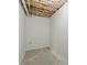 Unfinished basement area with exposed insulation and concrete floor at 11020 Knotty Pine Pl, Hampton, GA 30228
