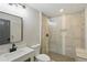 Updated bathroom with a tiled shower and black fixtures at 11020 Knotty Pine Pl, Hampton, GA 30228