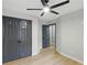 Bedroom features a ceiling fan, LVP floors, and large closets at 11020 Knotty Pine Pl, Hampton, GA 30228