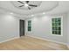 Spacious bedroom featuring a ceiling fan and two windows with natural light at 11020 Knotty Pine Pl, Hampton, GA 30228