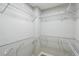 Spacious walk-in closet with metal shelving and ample storage at 11020 Knotty Pine Pl, Hampton, GA 30228