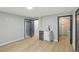 Open living area with a wet bar and access to the bathroom at 11020 Knotty Pine Pl, Hampton, GA 30228