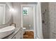 Modern bathroom with a sleek vanity, stylish fixtures, and a tiled shower, designed for comfort and style at 1544 Bullard Rd, Powder Springs, GA 30127