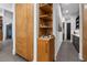 Hallway with wood cabinets and open shelving featuring unique decor at 1544 Bullard Rd, Powder Springs, GA 30127