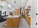 Modern kitchen offers stainless steel appliances, marble countertops, and a large island with seating at 1544 Bullard Rd, Powder Springs, GA 30127