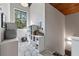Cozy landing area with natural light from a large window, complete with storage and decorative plants at 1544 Bullard Rd, Powder Springs, GA 30127