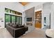 Open-concept living room boasts media center, electric fireplace, and access to covered patio at 1544 Bullard Rd, Powder Springs, GA 30127