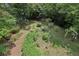 Bird's eye view of backyard with green lawn, plants, trees, and wooden fence at 1592 Braeburn Se Dr, Atlanta, GA 30316