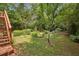 Landscaped backyard featuring lawn and assorted shrubs and plants at 1592 Braeburn Se Dr, Atlanta, GA 30316