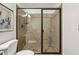 Bathroom featuring a glass-enclosed shower with neutral tile surround at 1592 Braeburn Se Dr, Atlanta, GA 30316