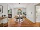 Dining room with hardwood floors, pendant lighting, and access to the kitchen at 1592 Braeburn Se Dr, Atlanta, GA 30316