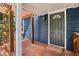 Close up of the front door and a wooden deck with wooden beams at 1592 Braeburn Se Dr, Atlanta, GA 30316