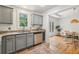 Updated kitchen features stainless steel appliances, granite countertops, and tile floors at 1592 Braeburn Se Dr, Atlanta, GA 30316