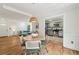 Open-concept living room and dining area with hardwood floors leads to a modern kitchen at 1592 Braeburn Se Dr, Atlanta, GA 30316