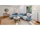 Living room featuring a comfortable sofa, stylish decor, and ample natural light at 1592 Braeburn Se Dr, Atlanta, GA 30316