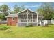 Spacious backyard view featuring a screen porch and patio, ideal for outdoor enjoyment and entertaining guests at 2855 Monticello Pl, Decatur, GA 30030