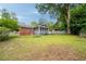 Expansive backyard with mature trees, lush greenery, screen porch and plenty of room for outdoor activities at 2855 Monticello Pl, Decatur, GA 30030