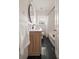 A well-lit bathroom with a modern vanity, subway tile, large mirror, and a shower with curtain at 2855 Monticello Pl, Decatur, GA 30030