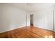 An empty bedroom with hardwood floors, closet, large windows, and fresh paint at 2855 Monticello Pl, Decatur, GA 30030