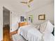 A sunlit bedroom with hardwood floors, window, closet, modern decor, and cozy accents at 2855 Monticello Pl, Decatur, GA 30030