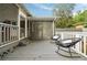 Outdoor seating on a covered patio offers a backyard view of the large lot and mature landscaping at 2855 Monticello Pl, Decatur, GA 30030