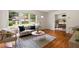Cozy living room with a comfortable sofa, hardwood floors, and a view of the front yard at 2855 Monticello Pl, Decatur, GA 30030